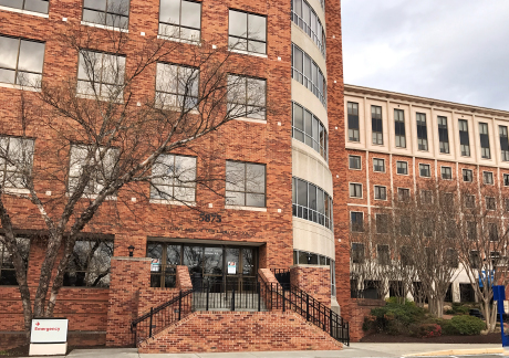 Brick building with stairs and many windows