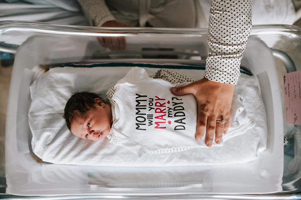 Baby's dad proposed to mom with "mommy will you marry my daddy" onesie delivered by Dr. Draper, VPFW OBGYN.