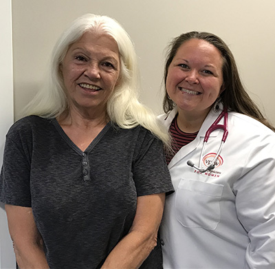 VPFW Nurse Practitioner Lauren Cook with Senior Patient Smiling