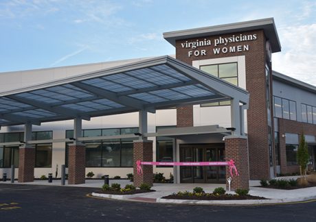 Front of VPFW Koger Center building with pink ribbon for grand opening