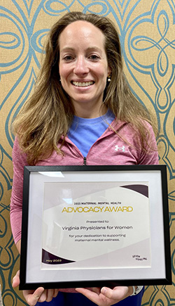 Dr. Giles Holding VPFW's Maternal Mental Health Advocacy Award from Seven Starling crop