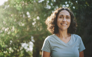 Woman in short sleeves smiling after having a ThermiVa Special discounted treatment 15 percent off