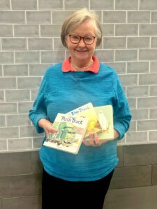 Beth Butner CCH Christmas Mother in Teal holding books