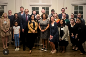 VPFW doctors and Virginia legislators in business attire standing together and smiling